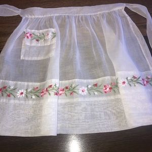 Vintage embroidered half apron with pocket.